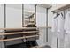 Walk-in closet featuring wire shelving, custom drawers, and ample storage space for shoes at 7432 Olivewood Ave, Orlando, FL 32829
