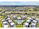 Drone view of the townhome community and pool, with a picturesque backdrop featuring lush landscapes and scenic views at 7770 Sandy Ridge Dr # 117, Reunion, FL 34747