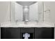 Bright bathroom featuring double sinks, a large mirror, and modern fixtures, offering a clean and stylish space at 7770 Sandy Ridge Dr # 117, Reunion, FL 34747