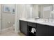 Elegant bathroom with double vanity, modern fixtures and a neutral color scheme at 7770 Sandy Ridge Dr # 117, Reunion, FL 34747