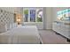 Spacious bedroom with a large window that overlooks the outdoors and plenty of storage at 7770 Sandy Ridge Dr # 117, Reunion, FL 34747
