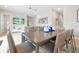 Stylish dining area with ceiling fan adjacent to an open living space at 7770 Sandy Ridge Dr # 117, Reunion, FL 34747