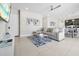 Cozy living room with a comfortable sectional sofa, modern décor, and an open layout to the dining area at 7770 Sandy Ridge Dr # 117, Reunion, FL 34747