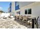 Spacious patio with an outdoor dining table and chairs, ideal for entertaining and enjoying the weather at 7770 Sandy Ridge Dr # 117, Reunion, FL 34747
