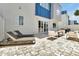 Private patio with sleek furniture, sun loungers, and access to the home, perfect for outdoor enjoyment at 7770 Sandy Ridge Dr # 117, Reunion, FL 34747