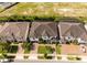 Aerial view of the homes showing the tile roof and well-manicured lawn at 8066 Ludington Cir, Orlando, FL 32836