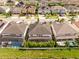 Aerial shot of the homes with dark tile roofs and screened in pools at 8066 Ludington Cir, Orlando, FL 32836