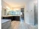 Spacious bathroom featuring double vanity, soaking tub and walk-in shower at 8066 Ludington Cir, Orlando, FL 32836