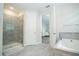 Bright bathroom with walk-in shower and soaking tub at 8066 Ludington Cir, Orlando, FL 32836