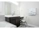 Bathroom with a vanity and modern fixtures, complemented by neutral color at 8066 Ludington Cir, Orlando, FL 32836