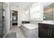 Bathroom showcasing tub, shower, double vanity, and tiled flooring at 8066 Ludington Cir, Orlando, FL 32836