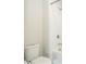 Bathroom featuring a toilet, shower and tub combination with white subway tiles at 8066 Ludington Cir, Orlando, FL 32836