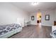 Large bedroom with stylish decor and a glimpse into an adjoining bathroom at 8066 Ludington Cir, Orlando, FL 32836