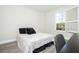 Stylish bedroom featuring gray-toned decor and a light filled window view at 8066 Ludington Cir, Orlando, FL 32836