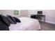 Inviting bedroom boasts a comfortable bed, modern desk setup, and a view from the window at 8066 Ludington Cir, Orlando, FL 32836