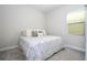 Bright bedroom with a comfortable bed, soft carpeting and lots of natural light at 8066 Ludington Cir, Orlando, FL 32836