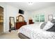 Bedroom featuring TV, mirror, dresser, with the view of the kitchen at 8066 Ludington Cir, Orlando, FL 32836