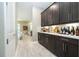 Spacious butler's pantry with sleek cabinetry, offering extra counter space and storage near the living area at 8066 Ludington Cir, Orlando, FL 32836