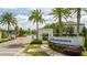 Entrance to a community with manicured landscaping and 'Estates at Parkside' sign at 8066 Ludington Cir, Orlando, FL 32836