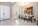 Bright dining room with a modern table and contemporary chandelier at 8066 Ludington Cir, Orlando, FL 32836