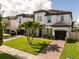 Gorgeous two-story house boasting lush green lawn, brick-paved driveway, and attached two-car garage at 8066 Ludington Cir, Orlando, FL 32836