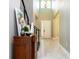 Bright foyer boasts hardwood floors, neutral walls, a high ceiling, and decorative accents at 8066 Ludington Cir, Orlando, FL 32836