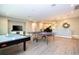 Large game room with a ping pong table, air hockey, and a television at 8066 Ludington Cir, Orlando, FL 32836