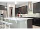 Well-equipped kitchen featuring a central island, stainless appliances, and ample cabinetry at 8066 Ludington Cir, Orlando, FL 32836
