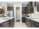 Updated kitchen featuring stainless steel appliances, a center island, and modern finishes at 8066 Ludington Cir, Orlando, FL 32836