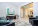 Comfortable home office space with stylish furniture, neutral walls, natural light and hardwood-style floors at 8066 Ludington Cir, Orlando, FL 32836