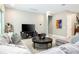 Comfortable living room featuring a large gray sectional sofa and stylish furnishings at 8066 Ludington Cir, Orlando, FL 32836