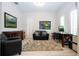 Cozy room with art, furniture, a computer, and shutters at 8066 Ludington Cir, Orlando, FL 32836