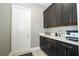 Pantry area with ample cabinet storage and white countertop space for convenience at 8066 Ludington Cir, Orlando, FL 32836