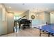 Upper level loft with a grand piano and wet bar, perfect for entertaining at 8066 Ludington Cir, Orlando, FL 32836
