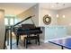 Upper level loft with a grand piano and wet bar, perfect for entertaining at 8066 Ludington Cir, Orlando, FL 32836