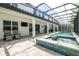 The backyard features an outdoor living area with a pool and spa, perfect for entertaining at 8066 Ludington Cir, Orlando, FL 32836