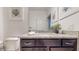 Bathroom featuring a vanity with a granite countertop, modern fixtures, and tasteful decor at 8806 Geneve Ct, Kissimmee, FL 34747