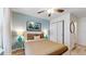 Bedroom with a blue accent wall, ceiling fan, closet, and a full size bed at 8806 Geneve Ct, Kissimmee, FL 34747