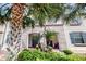 Charming townhome with a well-manicured garden and inviting entrance at 8806 Geneve Ct, Kissimmee, FL 34747