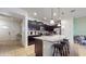 Modern kitchen with a large island, dark cabinets, stainless appliances, and ample counter space at 8806 Geneve Ct, Kissimmee, FL 34747