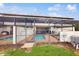 The screened-in pool area features a brick patio, outdoor seating, and access to the home at 8806 Geneve Ct, Kissimmee, FL 34747