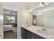 Bathroom featuring a double sink vanity and a view into the bedroom at 965 Maypole Dr, Apopka, FL 32703