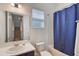 Bathroom featuring a single sink vanity, tub with shower, and a window at 965 Maypole Dr, Apopka, FL 32703