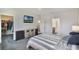 Bright bedroom featuring a TV, and access to the walk-in closet and bathroom at 965 Maypole Dr, Apopka, FL 32703