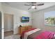 Cozy bedroom featuring a ceiling fan, carpet, and natural light from the window at 965 Maypole Dr, Apopka, FL 32703