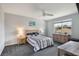 This bedroom offers a ceiling fan and a well-lit view from the window at 965 Maypole Dr, Apopka, FL 32703