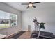 Bright workout room showcasing a ceiling fan and a picturesque view from the window at 965 Maypole Dr, Apopka, FL 32703