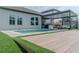 Private backyard with a sparkling pool, an outdoor lounge area, and a manicured lawn for relaxation and entertainment at 9863 Summerlake Groves St, Winter Garden, FL 34787