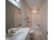 Clean bathroom featuring a white vanity, a shower-tub combo and tile flooring at 9863 Summerlake Groves St, Winter Garden, FL 34787
