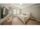 Serene bedroom features sleek furniture, natural light, and stylish decor at 9863 Summerlake Groves St, Winter Garden, FL 34787